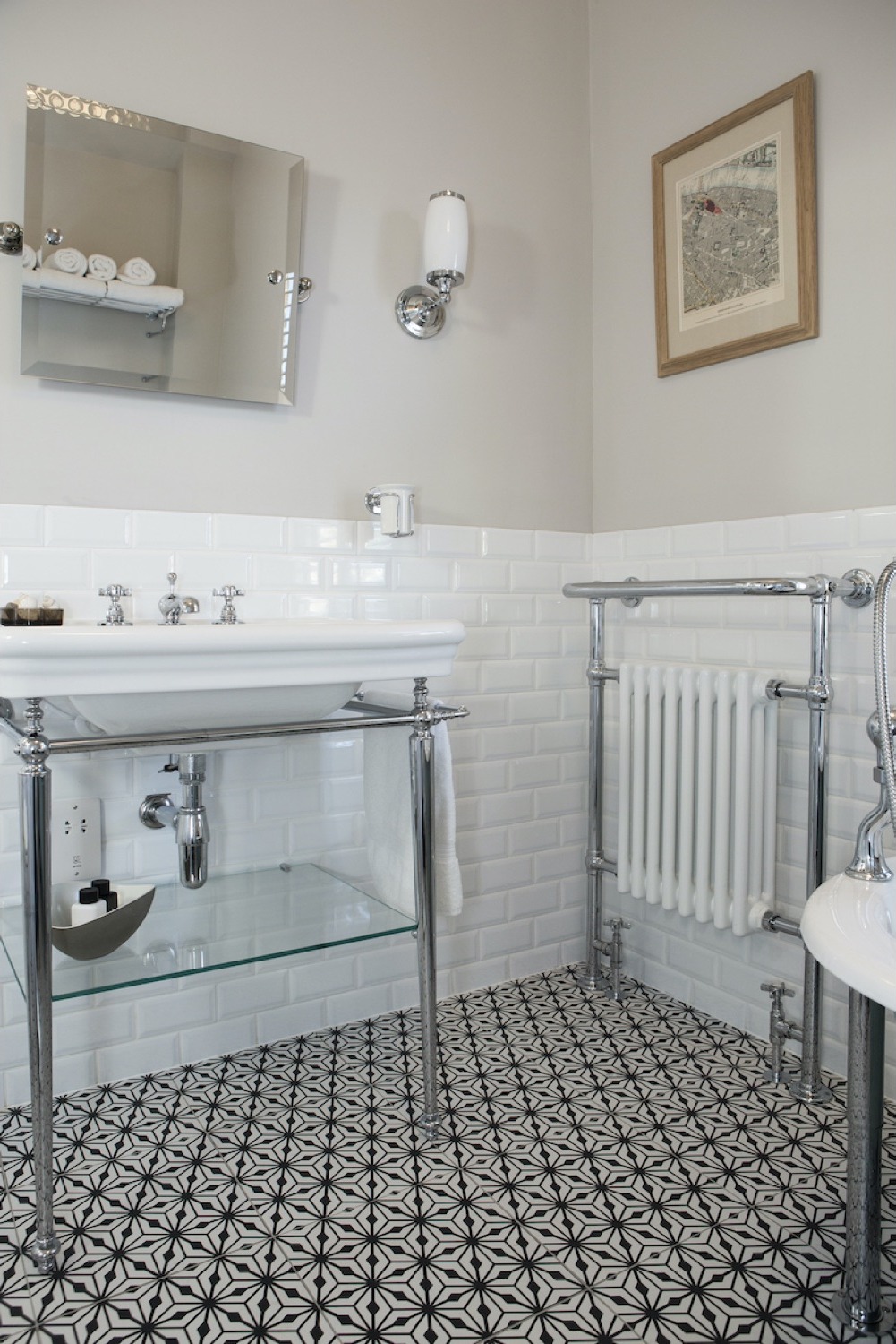 Chrome washstand with glass shelf and traditional heated towel rail