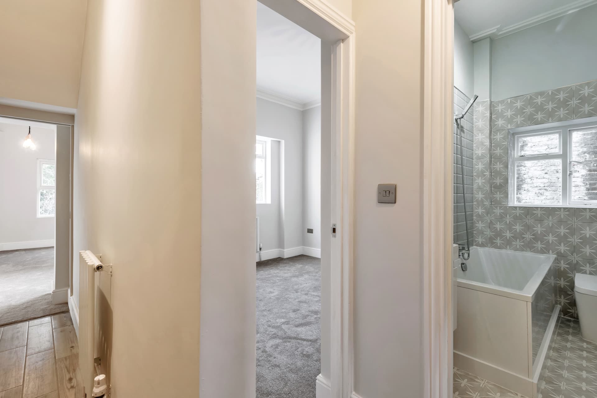 Hallway view into the bedroom and bathroom